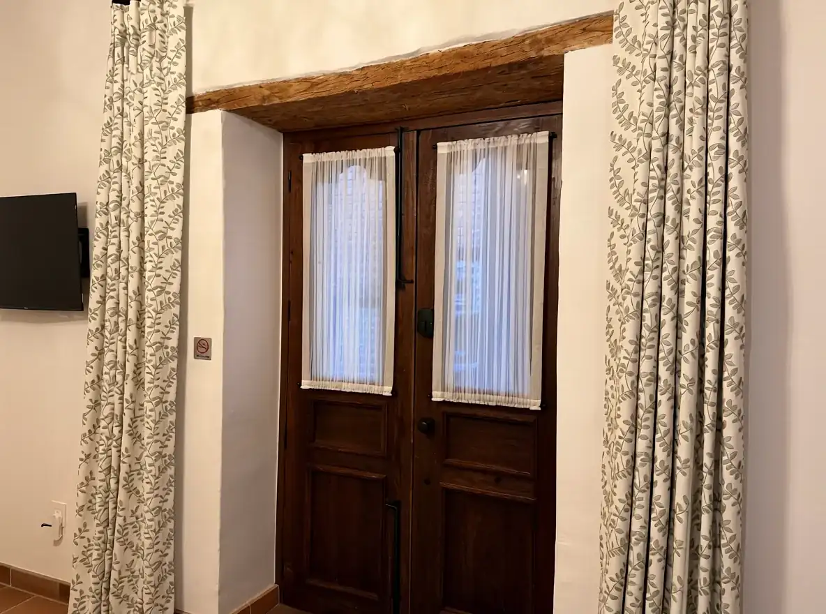 Drapery installed around a wood doorway