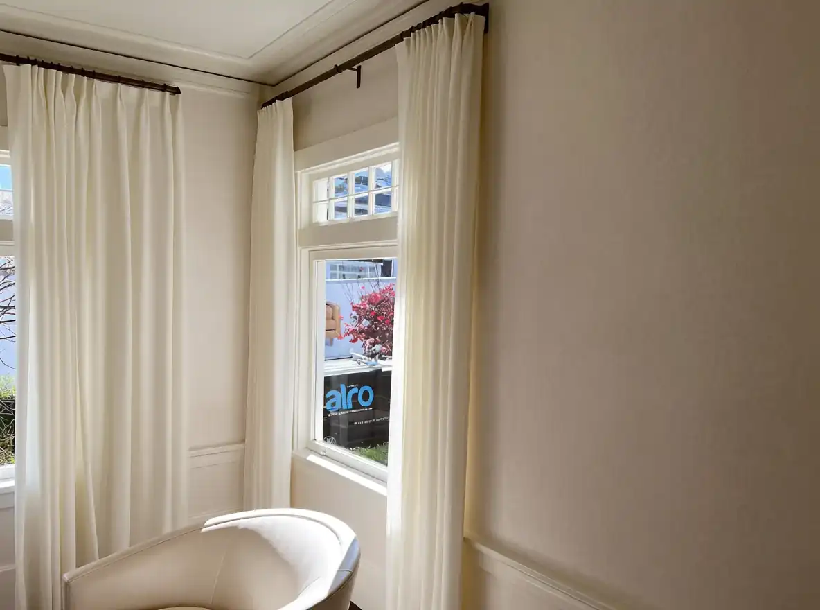 Sheer treatment installed along a bright hallway