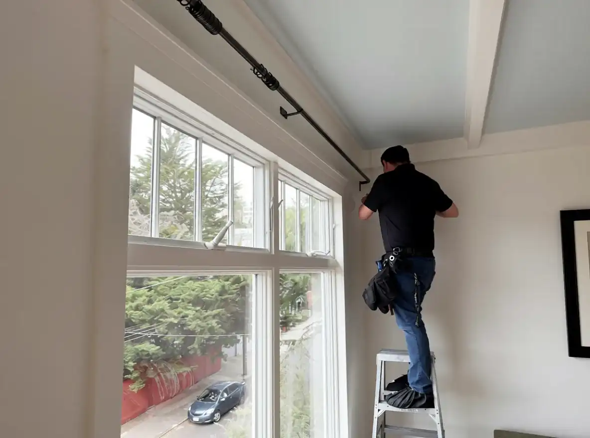 Installer working beside a residential window