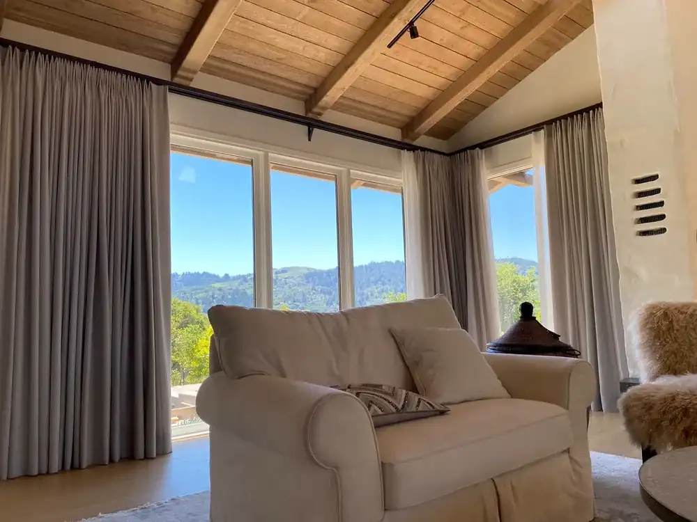 Custom drapery framing a residential living room